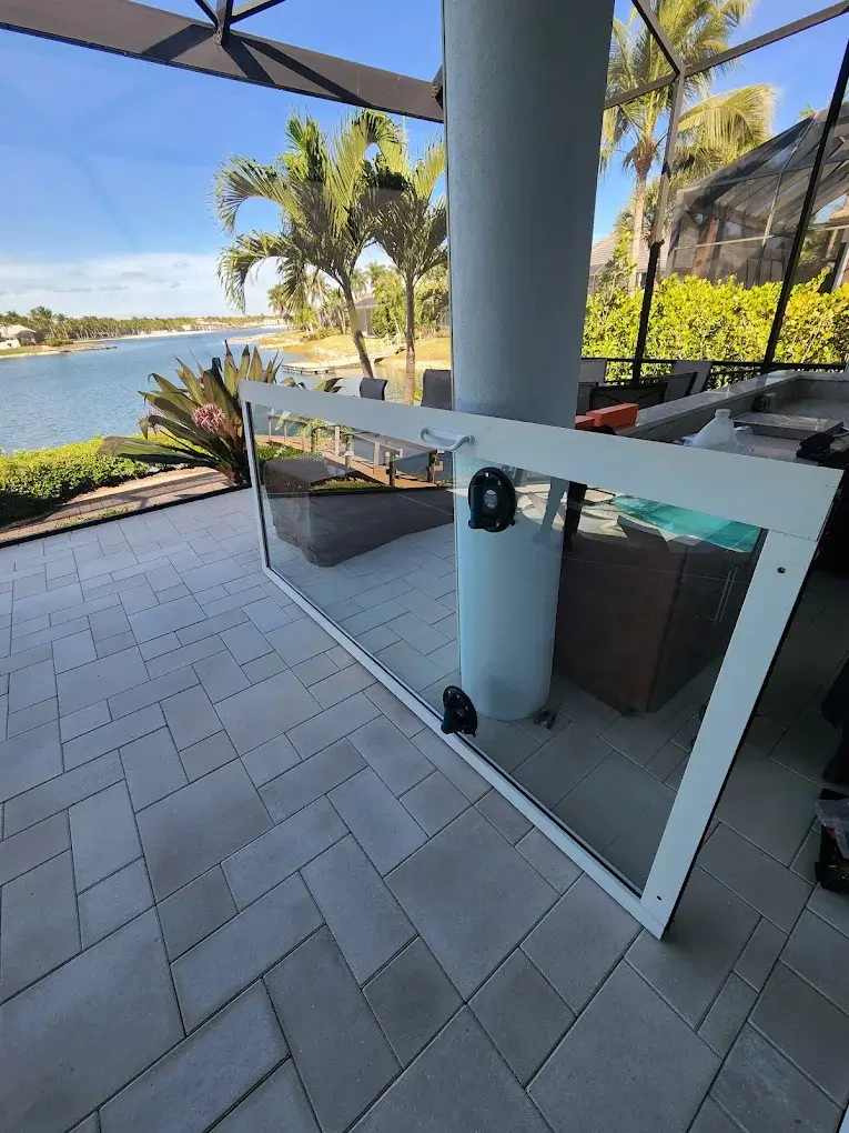 New sliding glass patio door panel ready for installation at a waterfront home in Collier County